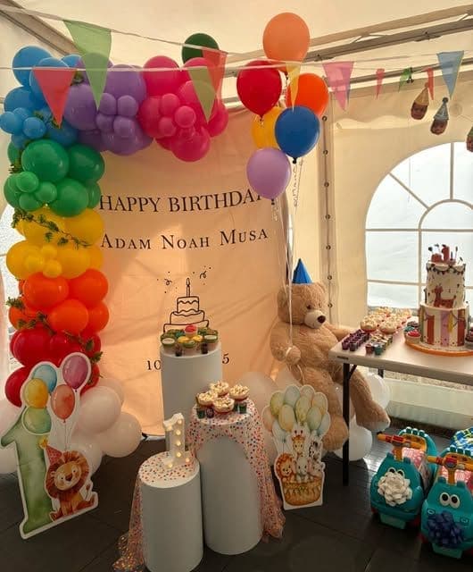 A full first birthday setup in a marquee