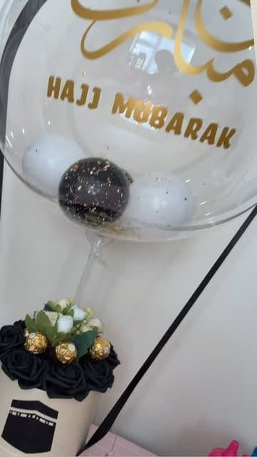 Hajj Mubarak bubble balloon over a black rose box