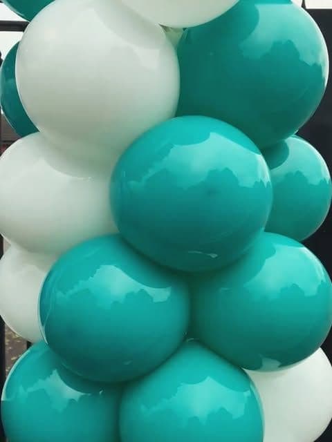 Teal and white balloon column